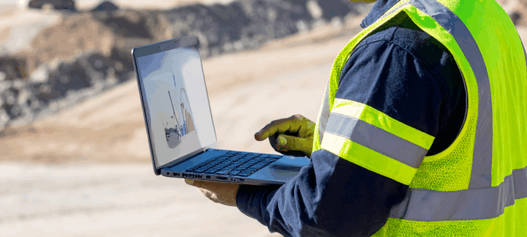Senior Engineer 1 Engineer looking at charts on laptop
